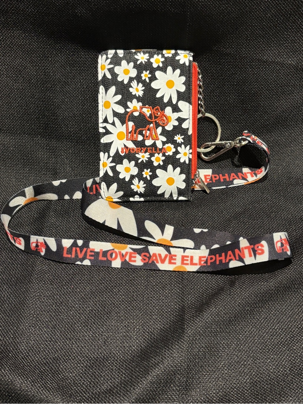 ivory ella Black Daisy Card Holder with Orange Accent Lanyard